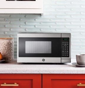 GE Appliances JEM3072SHSS microwave in a stylish kitchen